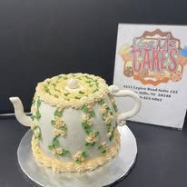 Floral teapot custom cake from Kiss Me Cakes