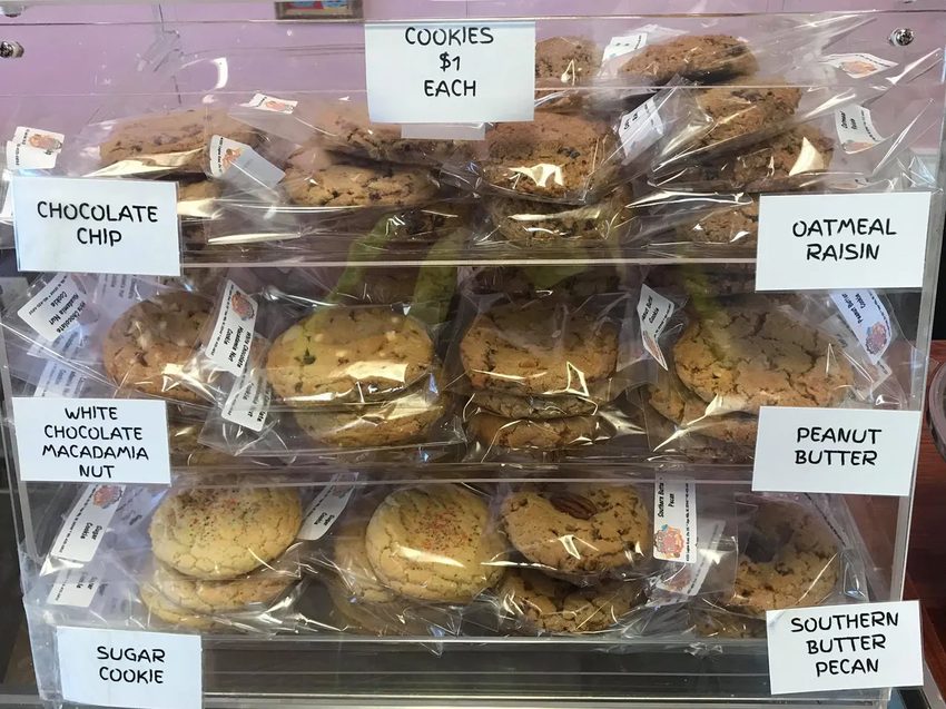 Fresh cookie display at Kiss Me Cakes bakery in Hope Mills